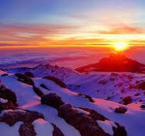Climber resting during summit push on Kilimanjaro